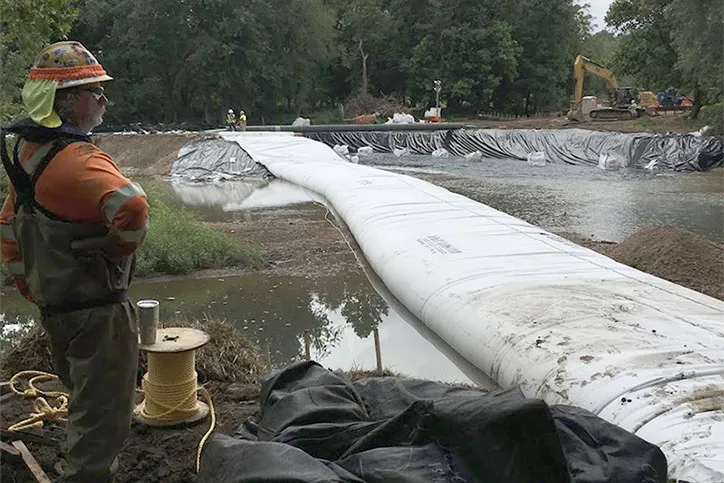 Cofferdam Installation Contractor Looking Over Project with Inflated Cofferdam