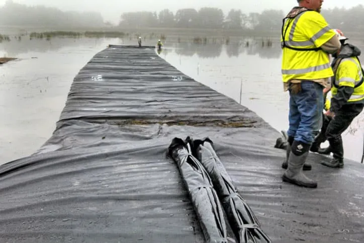 View of Two Workers on Cofferdam Installation