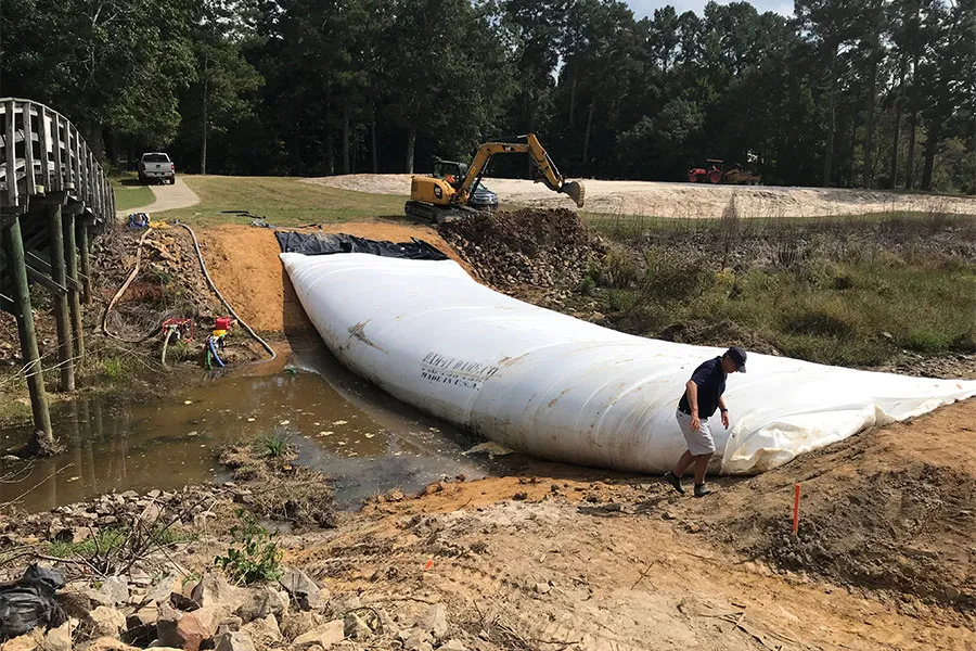 Man Installing Water-Inflated Cofferdam