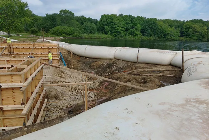Water Inflated Cofferdam Next To Construction Project