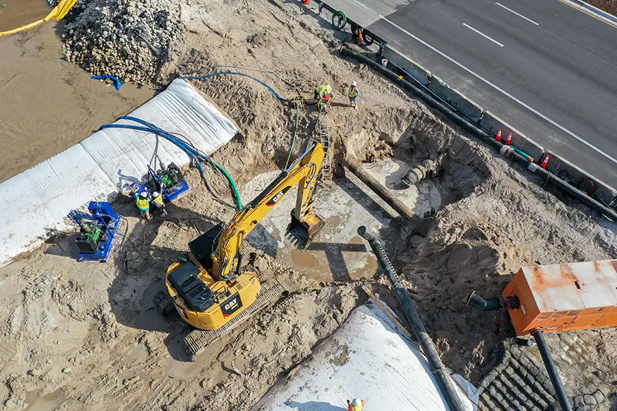 Top Down View of Heavy Equipment Working with Inflatable Cofferdam
