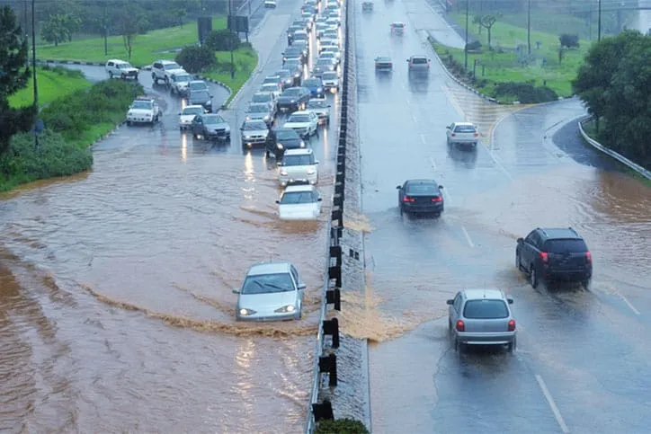 Overview of major road flooded with cars.