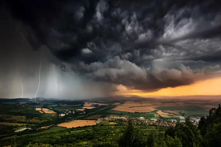 View of Strong Storms Over Suburban Town