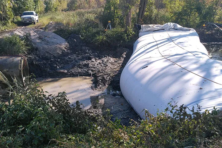 Water Filled Cofferdam In Creek with Drain Pipe