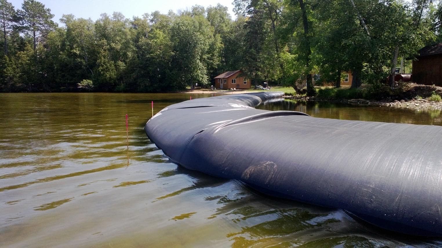 inflatable dam - an inflatable flood barrier being unrolled