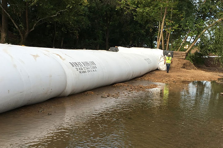 Dam-It-Dams Inflatable Cofferdam Rental Blocking Water on River