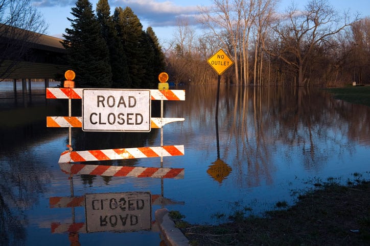 View of Road Closed Sign on Flooded Michigan Street